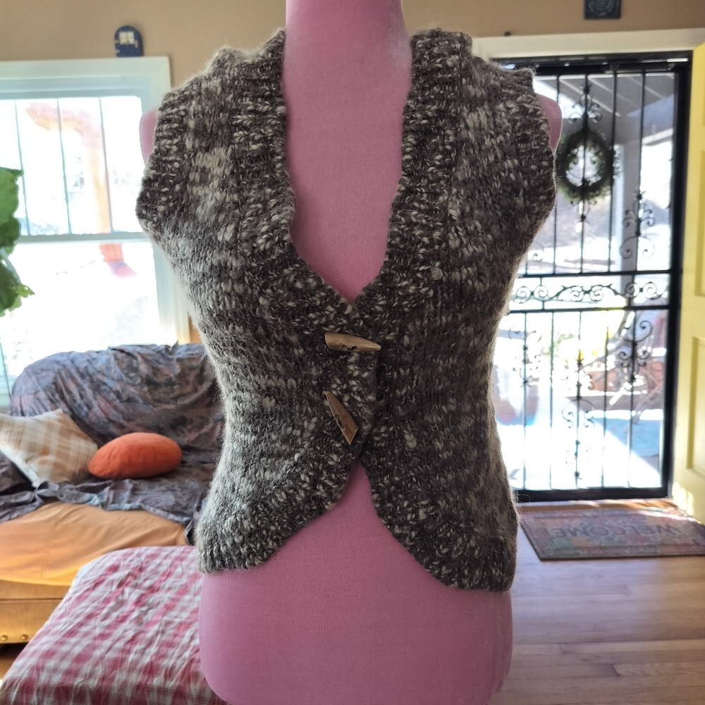 Wool blend vest with wooden buttons and hood.